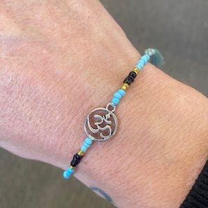 Gorgeous om charm skinny bracelet